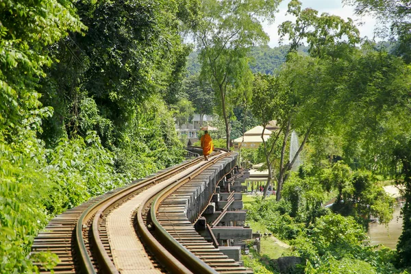 Stock Photo - Monk walks on the rails in nature — Stock Photo, Image