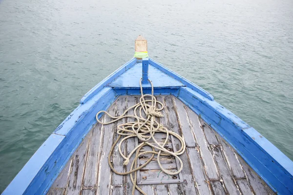 Driving a wooden boat in the sea, freedom conception — Stock Photo, Image