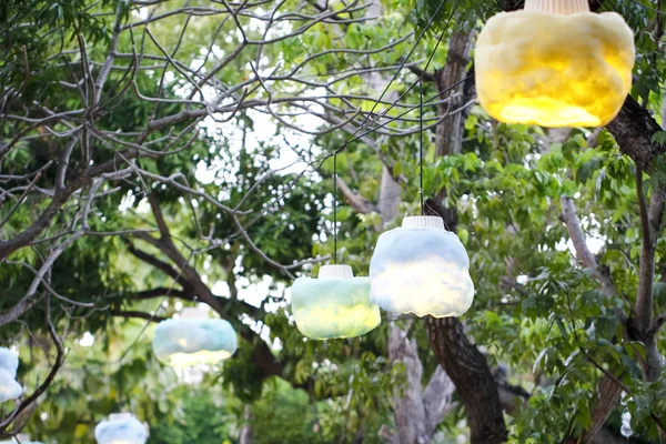 Vintage lamp hanging on tree in the evening — Stock Photo, Image