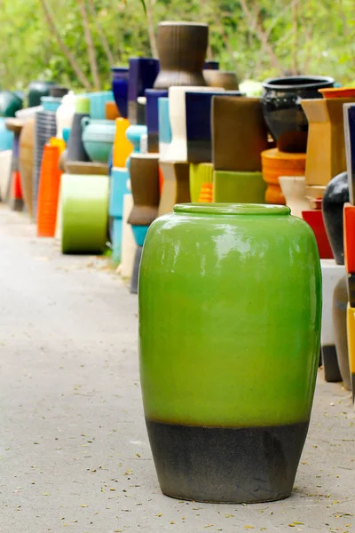 Lots of ceramic jars in different colors hand made parts — Stock Photo, Image