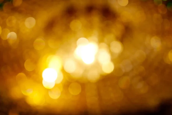 Rozmazané pozadí světle zlaté bokeh — Stock fotografie
