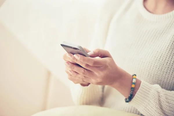 woman reading message on phone