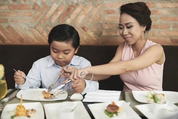Mother and son enjoying dinner in cafe — Stock Photo, Image