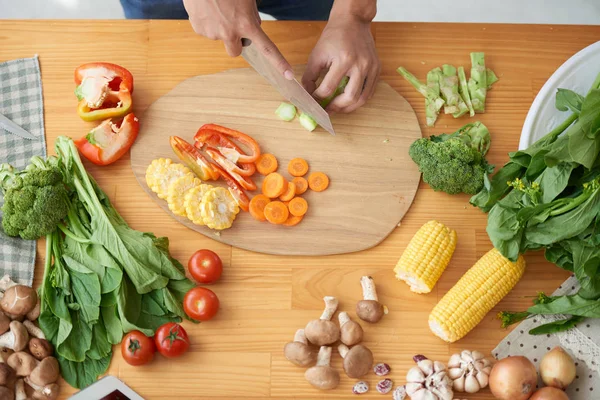 Person cutting ingredients for soup — Stock Image Person cutting ingredients for soup Stock Photo