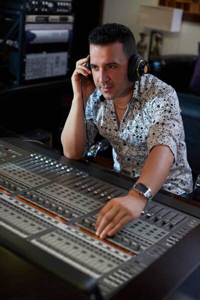 musicmaker working on new track in studio