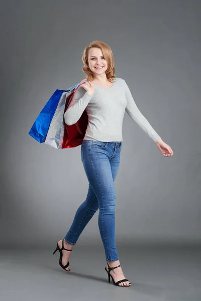 Customer walking with shopping bags — Stock Photo, Image