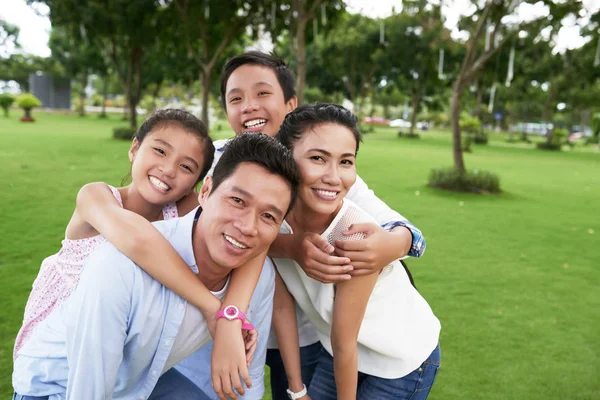 Family embracing when taking selfie — Stock Photo, Image