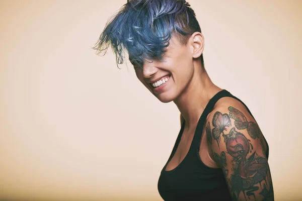 laughing teenage girl with blue hair