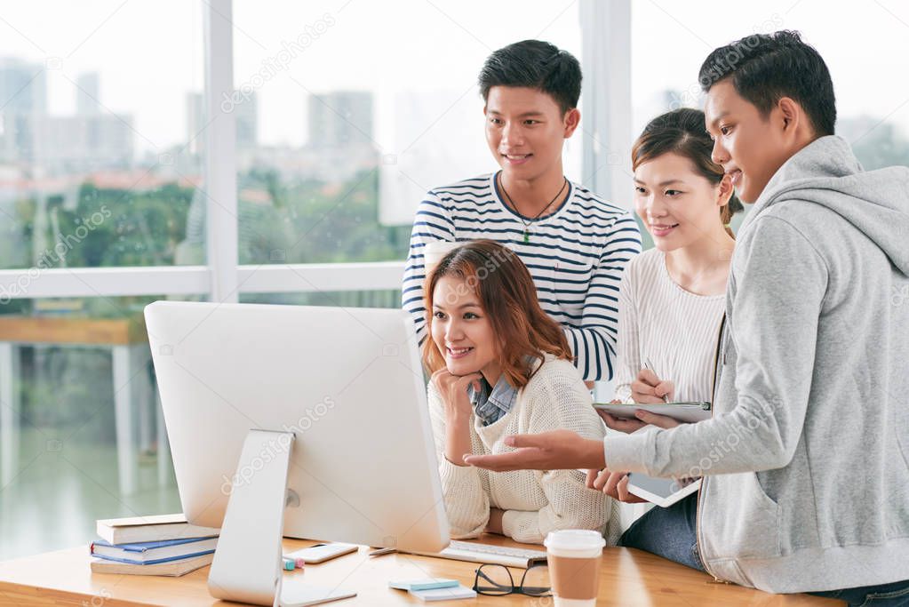 students gathered at computer