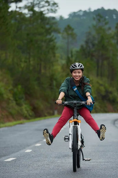 Young woman riding bicycle - Stock Image - Everypixel