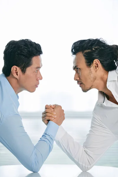 Businessmen competing in arm wrestling — Stock Photo, Image