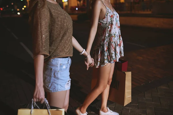 Sisters with shopping bags — Stock Photo, Image