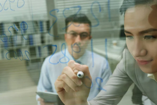 business lady drawing on glass wall