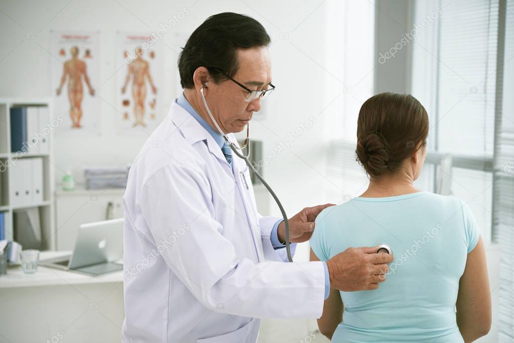 doctor examining patient in hospital