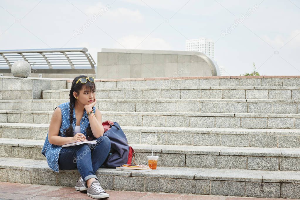 girl sitting on steps