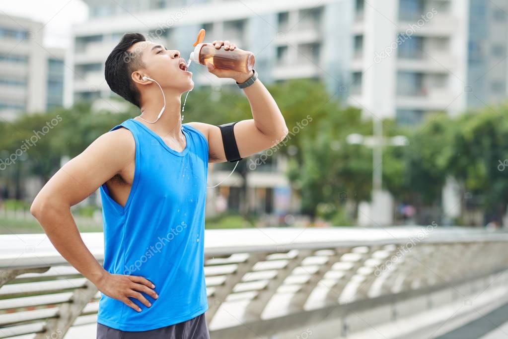 Man drinking water after marathon — Stock Photo © DragonImages 144046881