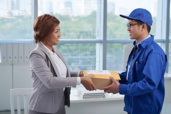 business woman receiving parcel