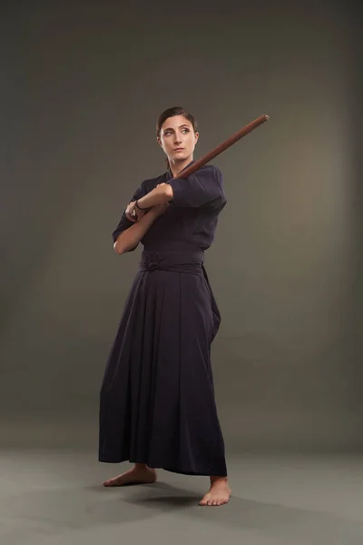 Woman in black with sword — Stock Photo, Image
