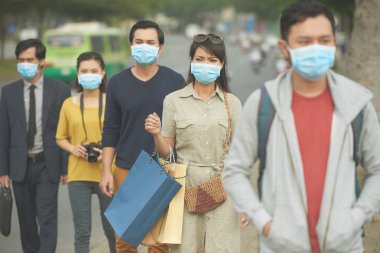 Citizens on street in masks clipart