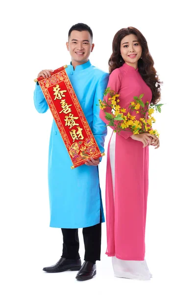 Lovely Asian Couple Wearing Traditional Costumes Holding Tet Holiday Attributes — Stock Photo, Image