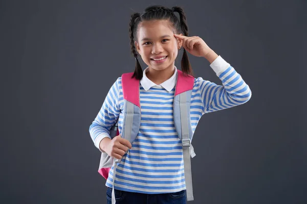 Retrato Colegiala Sonriente Apuntando Cabeza Aislada Gris —  Fotos de Stock