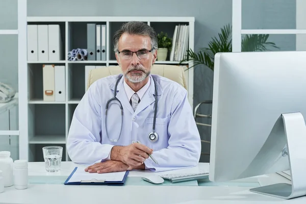 Portrait Mature Doctor His Table Office Clinic — Stock Photo, Image