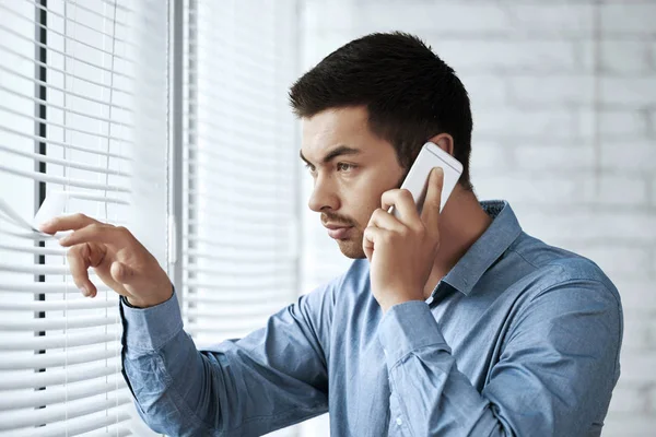 Businessman Calling Phone Looking Blinds — Stock Photo, Image