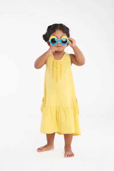 Full Length Portrait Cute Little Girl Yellow Dress Adjusting Sunglasses — Stock Photo, Image