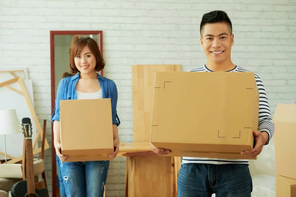 Smiling Asian Young Couple Carrying Carton Boxes While House Moving — Stock Photo, Image