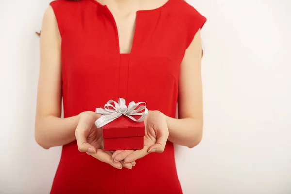 Woman Wearing Red Dress Holding Small Gift Box Hands While — Stock Photo, Image