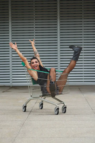 Happy Excited Fashionable Girl Sitting Shopping Cart Outdoors — Stock Photo, Image