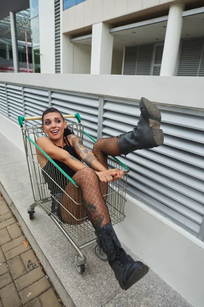 Attractive Alternative Girl Riding Shopping Cart — Stock Photo, Image