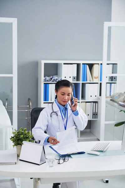 Vietnamese Female Doctor Reading Document Calling Phone — Stock Photo, Image