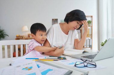 Little boy interfering with work of his mother clipart