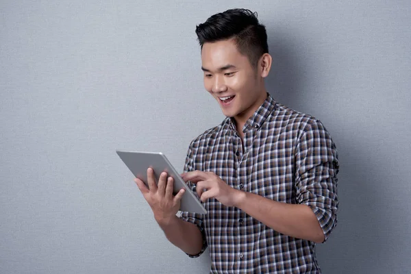 Cheerful Vietnamese Man Surfing Net Modern Digital Tablet — Stock Photo, Image