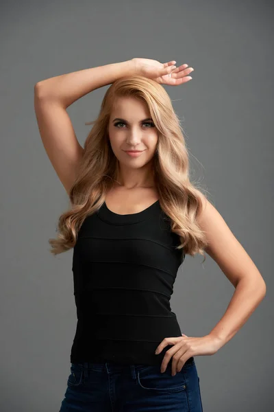 Portrait Confident Blonde Model Wearing Black Top Posing Grey Background — Stock Photo, Image