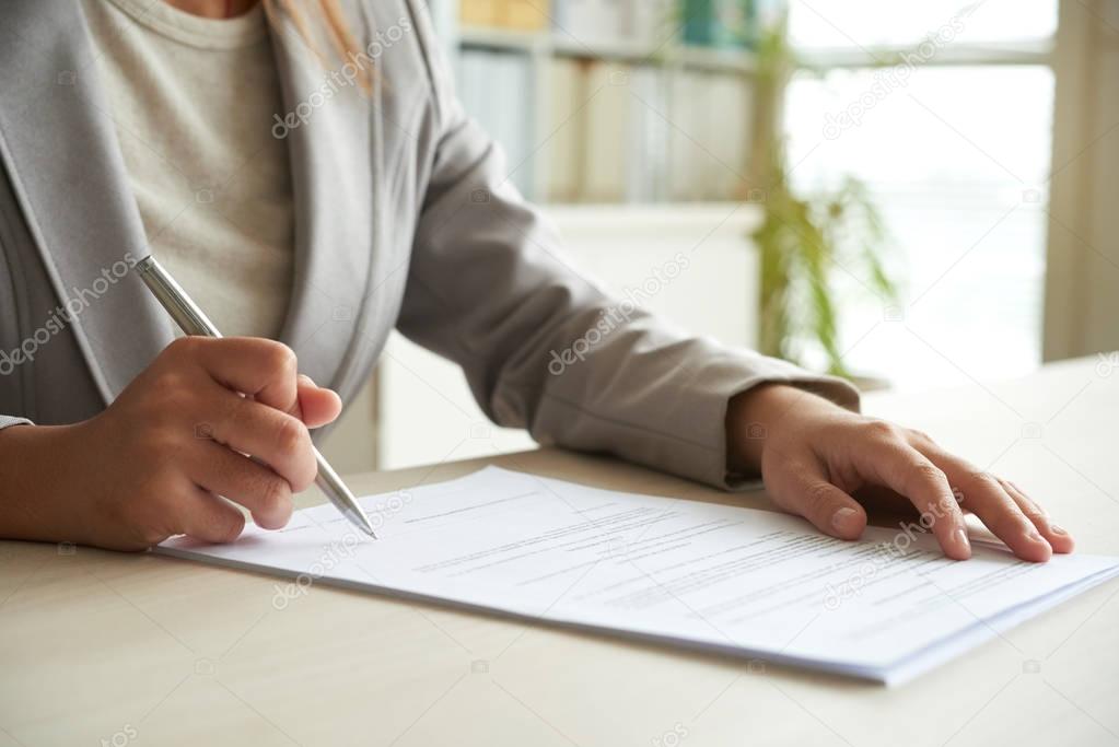 Cropped image of entrepreneur signing business contract