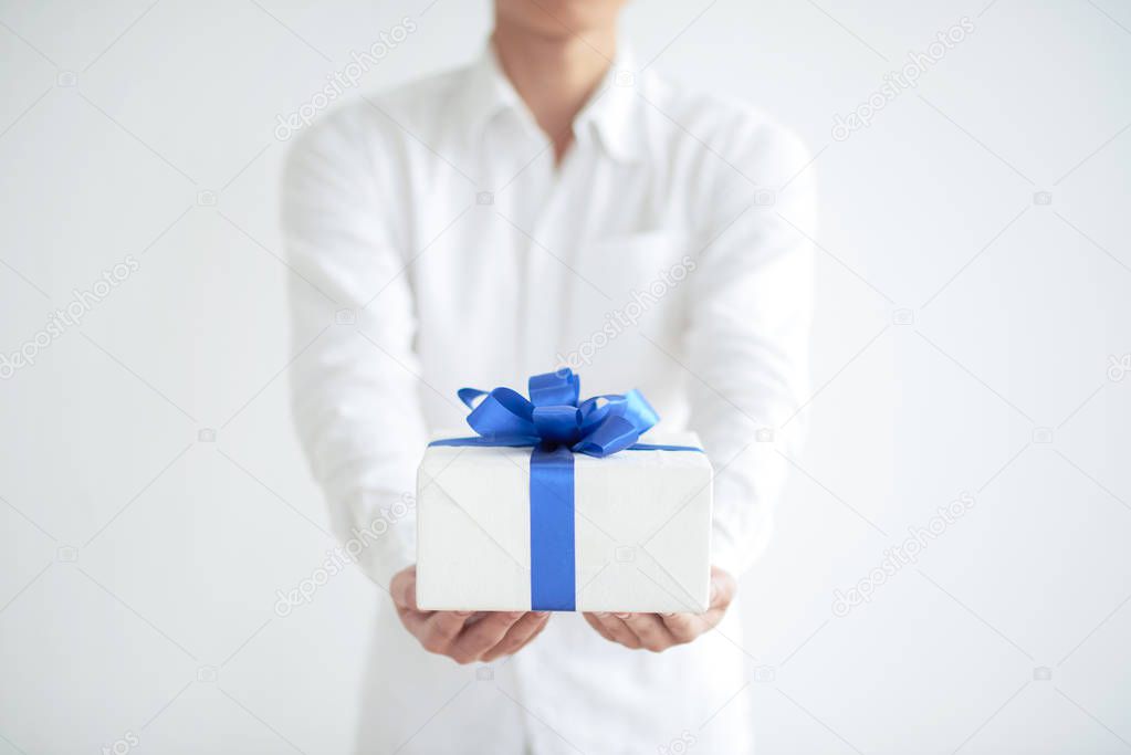 Man giving your birthday present, selective focus
