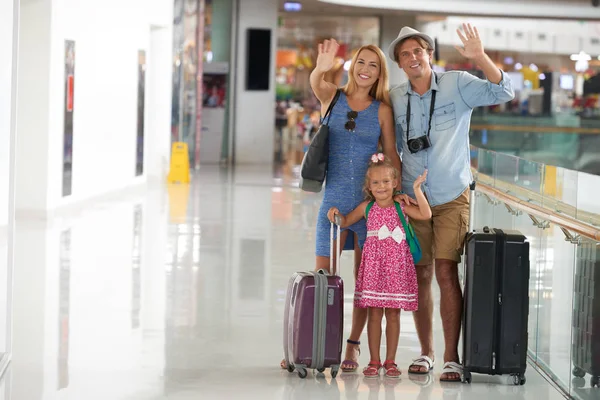 Cheerful Family Suitcases Waving Camera — Stock Photo, Image