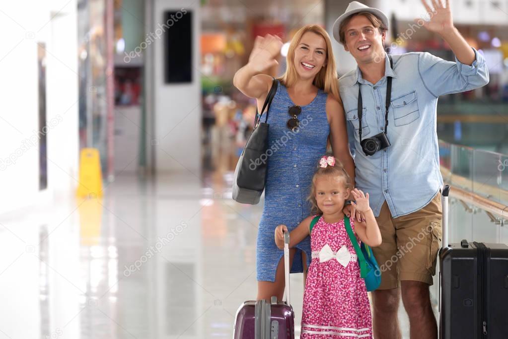 Father, mother and little daughter is ready to travel to another country