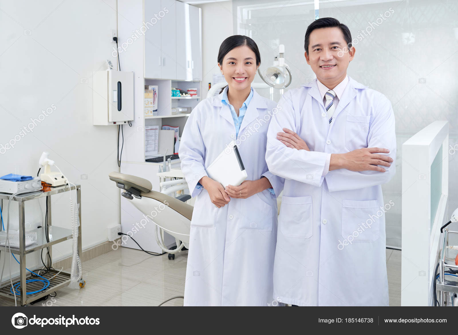 portrait smiling vietnamese dentist nurse looking camera stock dentist nurse