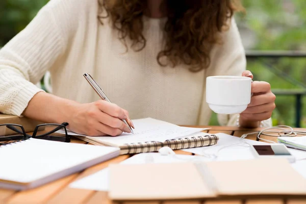 Cropped Image Female University Student Drinking Coffee Writing Essay Outdoor Stock Image