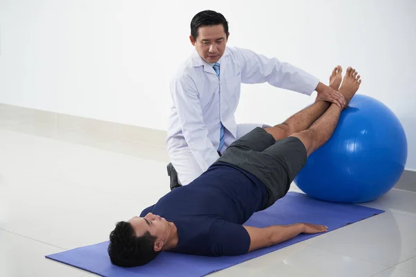 Vietnamese Young Man Doing Exercise Fit Ball Control His Doctor — Stock Photo, Image