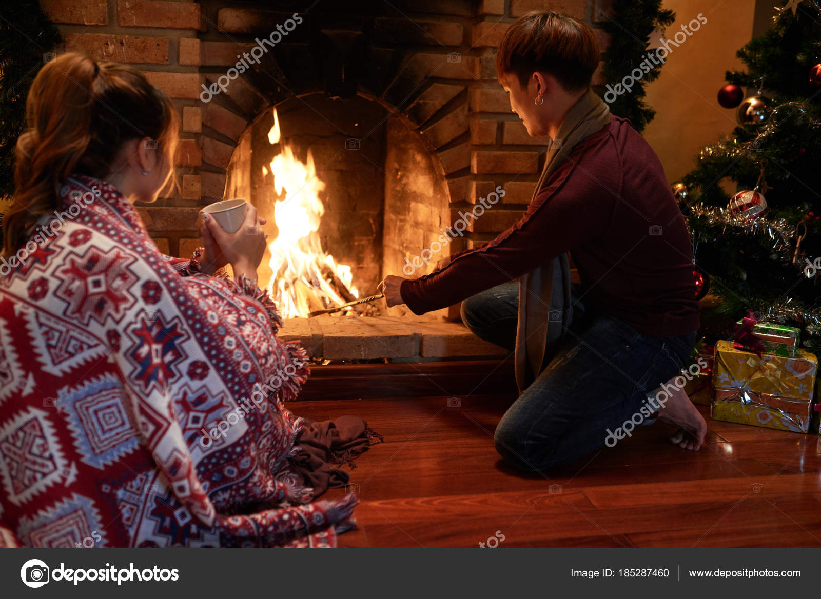 Man Adding Wood Fireplace Keep Burning Christmas Night Stock