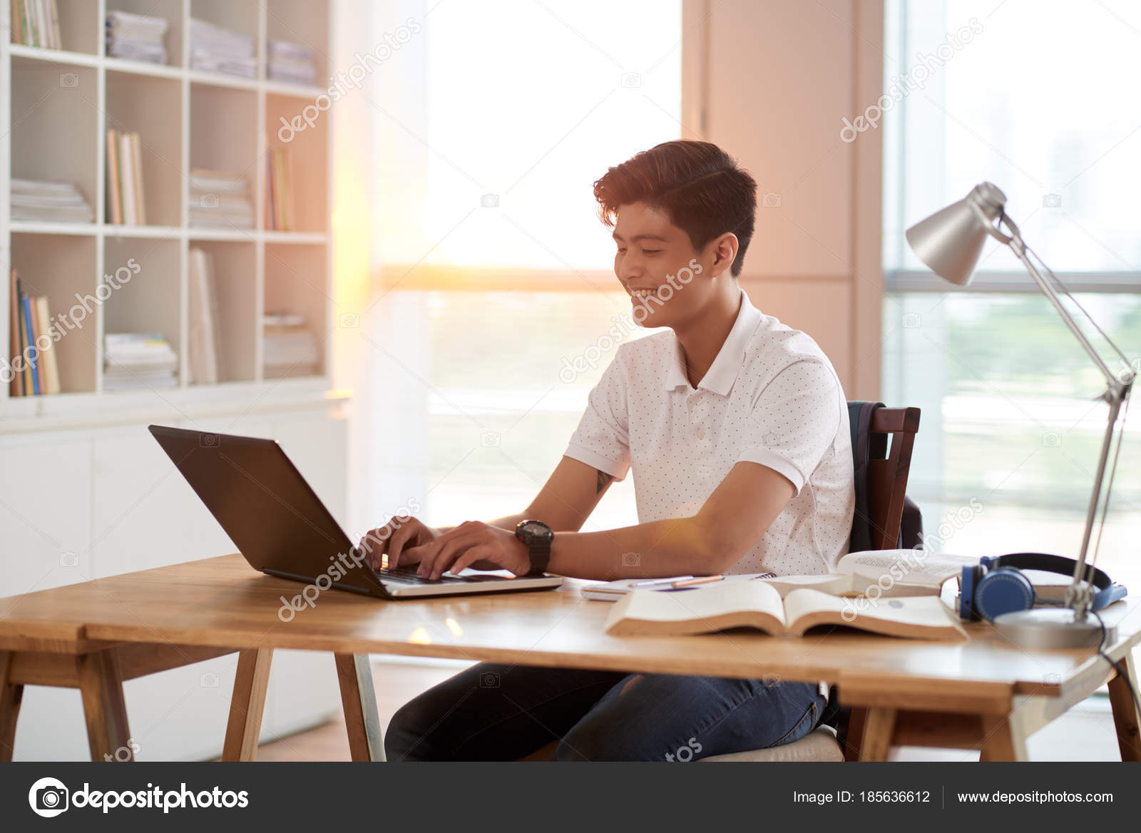 Handsome Vietnamese Student Doing Homework Laptop Home Stock Photo by