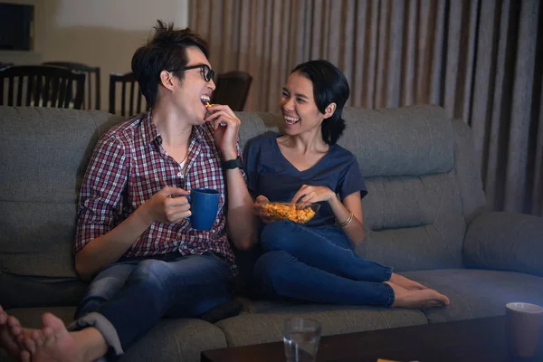 Laughing Asian Couple Eating Popcorn Watching Comedy Movie — Stock Photo, Image
