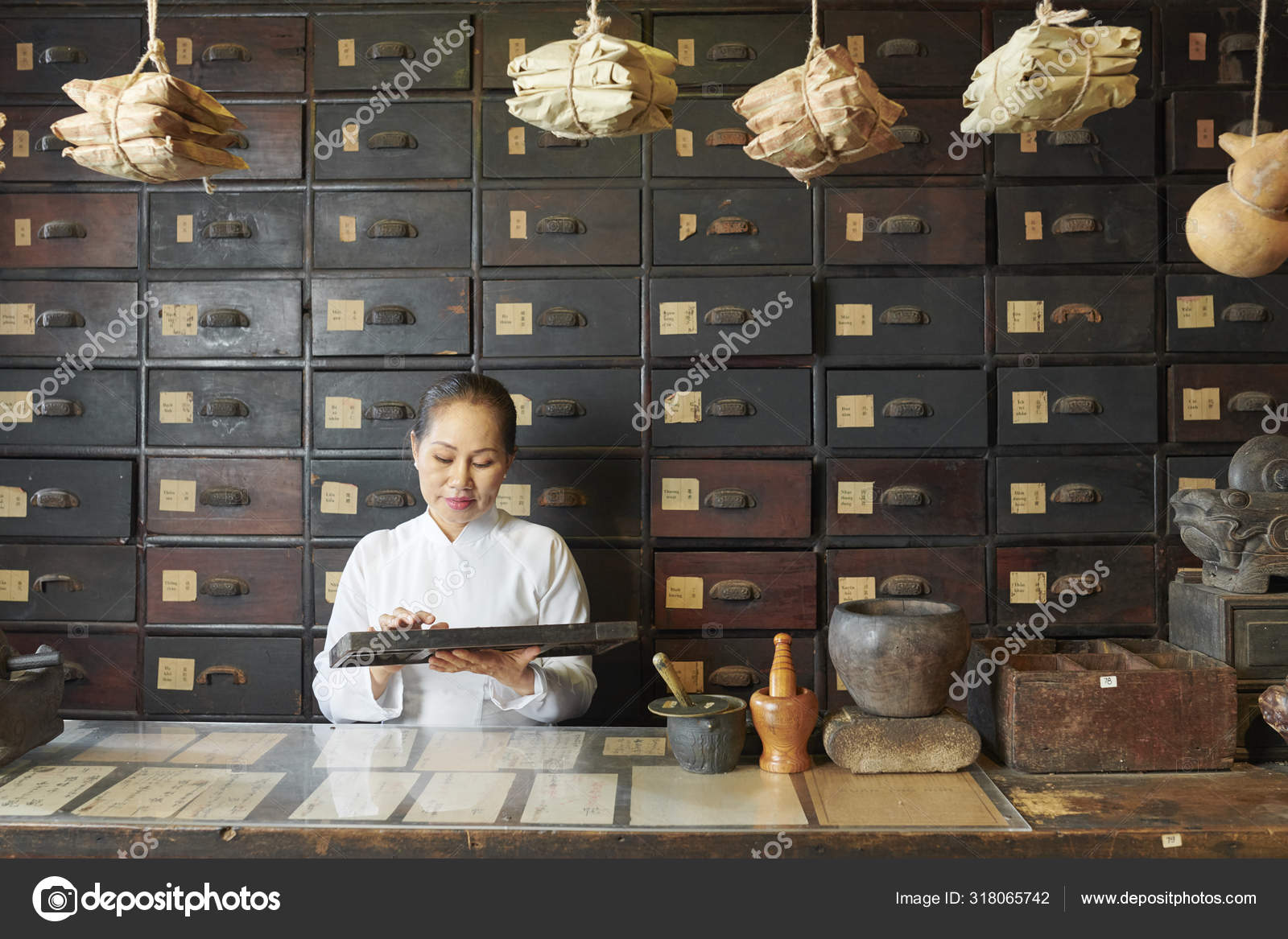 Traditional Chinese Medicine Practitioner Using Abacus Counting