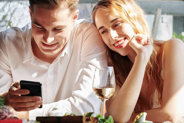 Cheerful Young Couple Checking Social Media Smartphone Dinner Restaurant — Stock Photo, Image