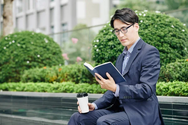 Handsome Asian Businessman Reading Good Book Drinking Coffee Outdoors Lunch — Stock Photo, Image