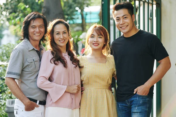 Portrait Happy Hugging Vietnamese Parents Adult Children Smiling Camera Standing — Stock Photo, Image